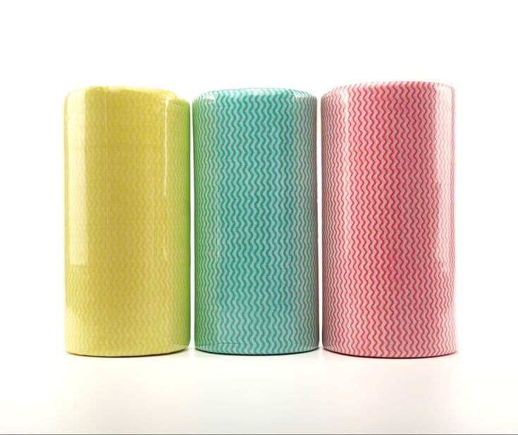 Rolled spunlace nonwoven fabric in yellow, green and pink